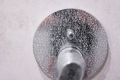 Shower handle with hard water spots